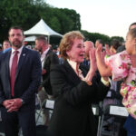 Secretary of Education Linda McMahon plays with a child of U.S. Secretary of Transportation Sean Duffy.