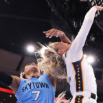 Sophie Cunningham of the Indiana Fever is fouled by DiJonai Carrington of the Chicago Sky during a game at United Center on August 8, 2026 in Chicago, Illinois. (Michael Reaves/Getty Images)