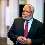 Lonnie Bunch III stands in the "American Aspirations" exhibit at the Smithsonian Castle on the National Mall.