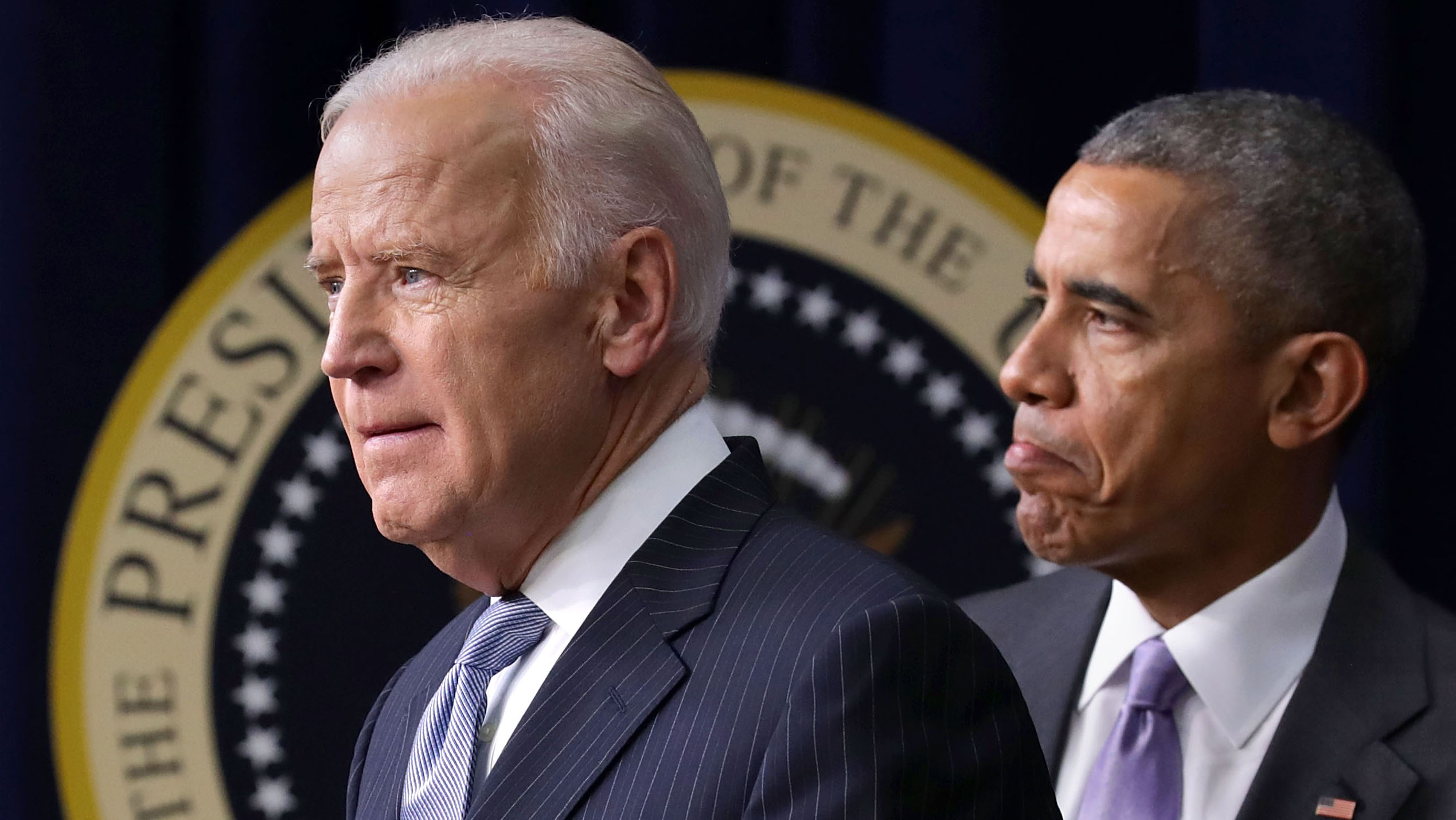 President Barack Obama (R) and Vice President Joe Biden deliver remarks before signing the 21st Century Cures Act into law at the Eisenhower Executive Office Building December 13, 2016 in Washington, DC. The legislation eases the development and approval of experimental treatments and reforms federal policy on mental health care. (Photo by Chip Somodevilla/Getty Images)