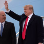 President Donald Trump waves while standing with Sen. Ron Johnson.