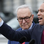 Hakeem Jeffries (R) (D-NY) speaks and points alongside Senate Democratic Leader Chuck Schumer (D-NY) on the steps of the U.S. Senate during an event with congressional Democrats.