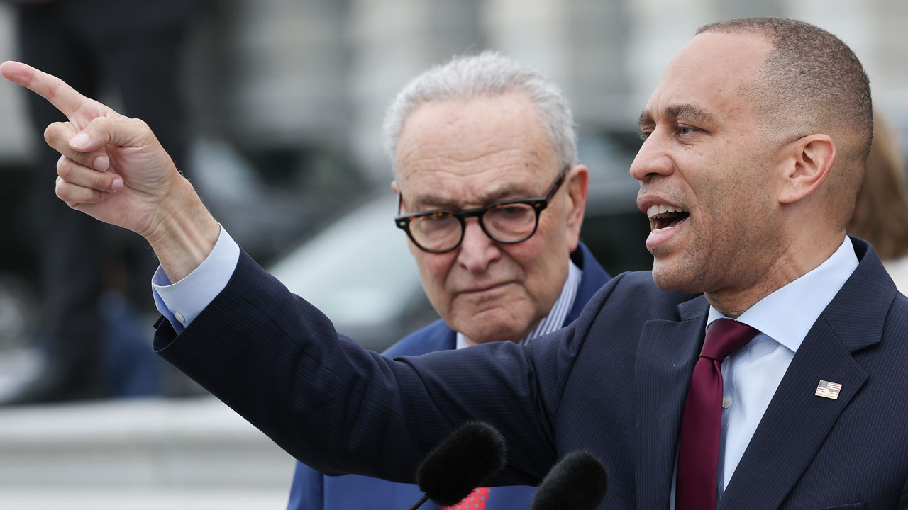 Hakeem Jeffries (R) (D-NY) speaks and points alongside Senate Democratic Leader Chuck Schumer (D-NY) on the steps of the U.S. Senate during an event with congressional Democrats.