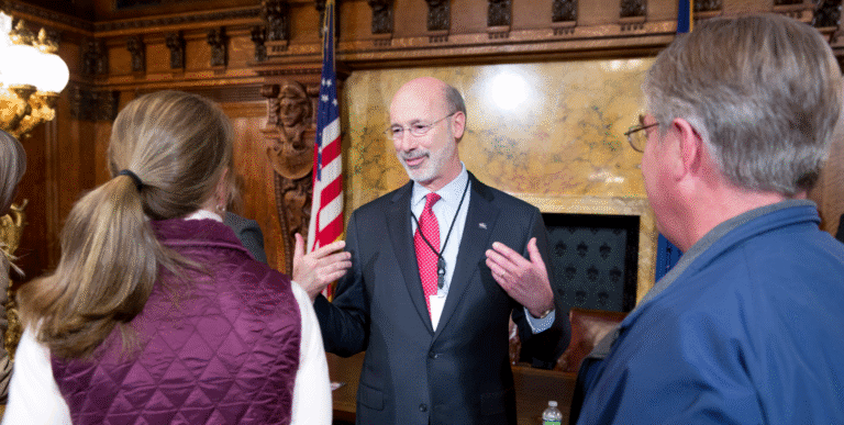 Ousted Open-Records Chief Sues Governor, Wants Job Back