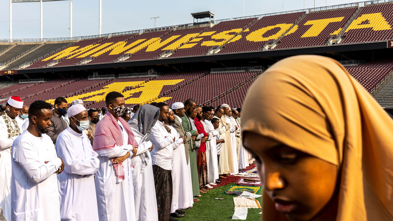 Muslim worshippers gather at the Huntington Bank Stadium during Eid al-Adha prayers and festivities.