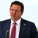 Florida Governor Ron DeSantis speaks during a press conference at the South Florida Detention Facility, nicknamed "Alligator Alcatraz," at the Dade-Collier Training and Transition Airport in Ochopee, Florida, on June 25, 2026. DeSantis announced that the facility is now closed and all detainees have been relocated. (Photo by CHANDAN KHANNA / AFP via Getty Images)