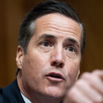 Sen. Bernie Moreno points in front of him to gesture during a hearing.