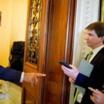 Senate Majority Leader John Thune (R-SD) speaks to reporters as he walks into the Senate Chamber of the U.S.