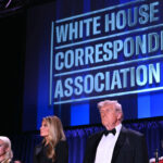 White House Press Secretary Karoline Leavitt, US First Lady Melania Trump, US President Donald Trump and CBS News senior White House correspondent Weijia Jiang stand in front of a blue backdrop reading "White House Correspondents' Dinner."