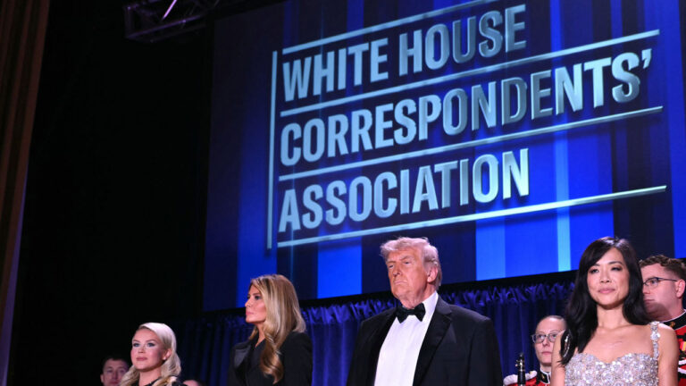 White House Press Secretary Karoline Leavitt, US First Lady Melania Trump, US President Donald Trump and CBS News senior White House correspondent Weijia Jiang stand in front of a blue backdrop reading "White House Correspondents' Dinner."