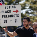 Democratic candidate for U.S. Senate in Michigan Abdul El-Sayed visits a polling place as residents cast their votes.