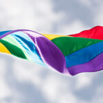 a pride flag in the wind