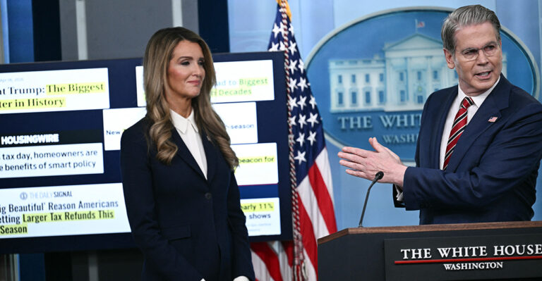 Kelly Loeffler stands at the podium