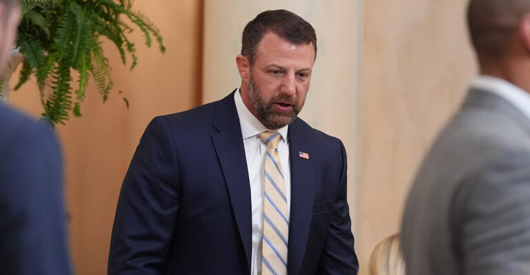 Markwayne Mullin walks.
