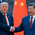 President Donald Trump (R) shakes hands with China's President Xi Jinping. (Kenny Holston/ AFP/Getty Images)