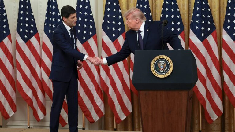 Kevin Warsh and Donald Trump shake hands